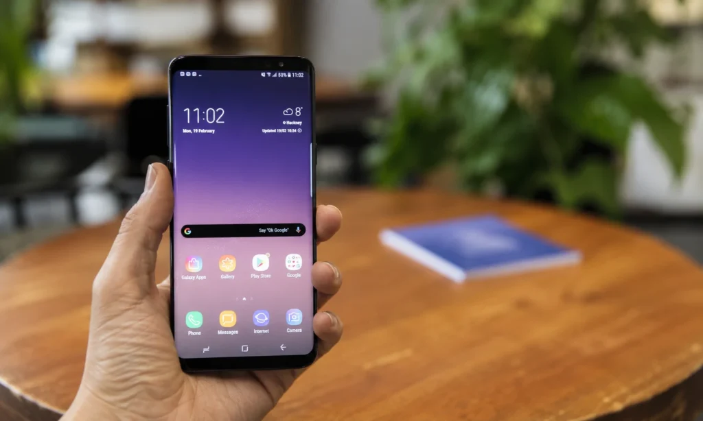 Futuristic smartphone concept showing AI technology, holographic display, and smart wearable integration in 2030